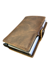brown leather eazicard wallet featuring a metal casing with RIFD protection.