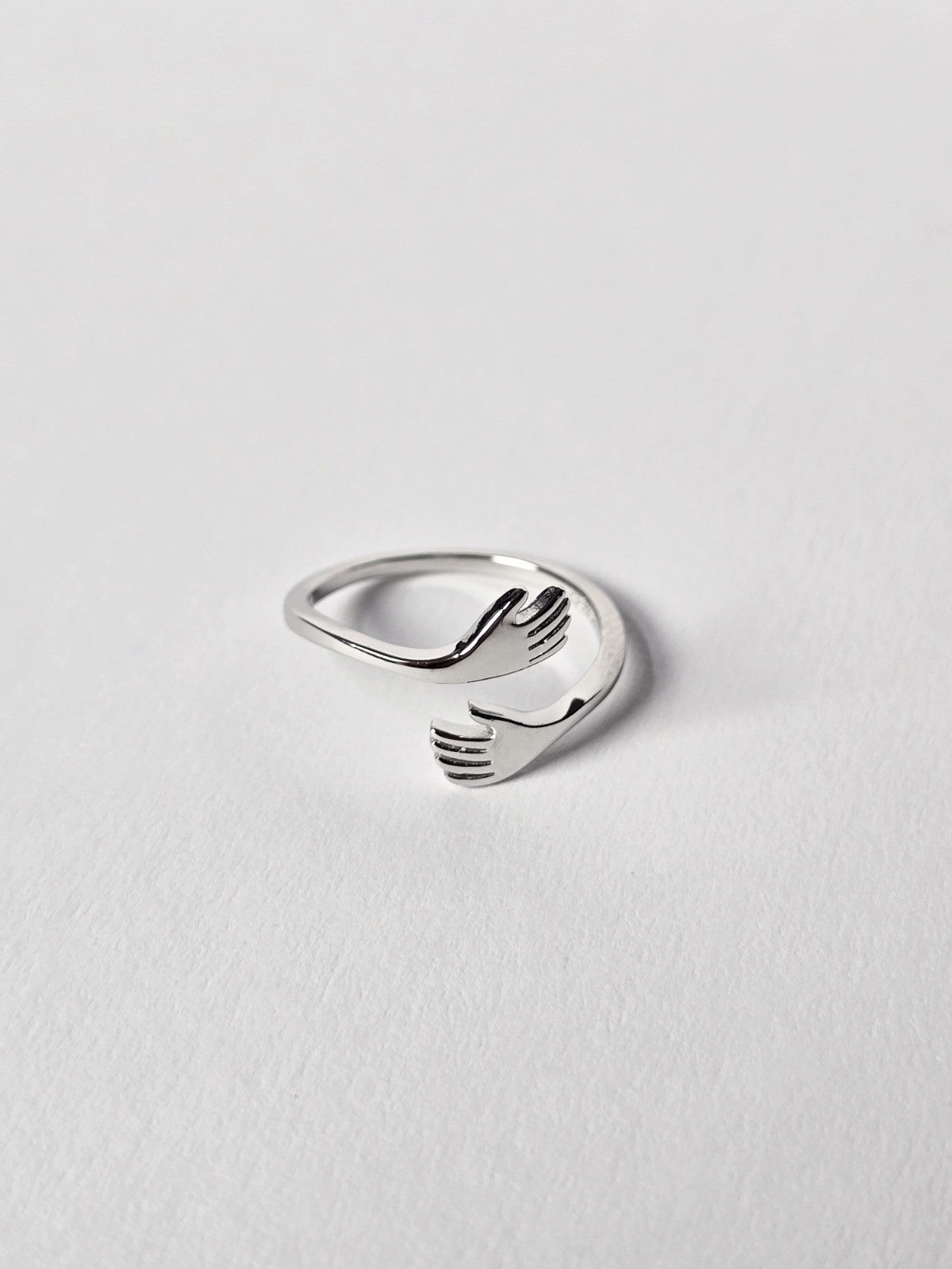 Sterling Silver ring with a unique design on a light grey background