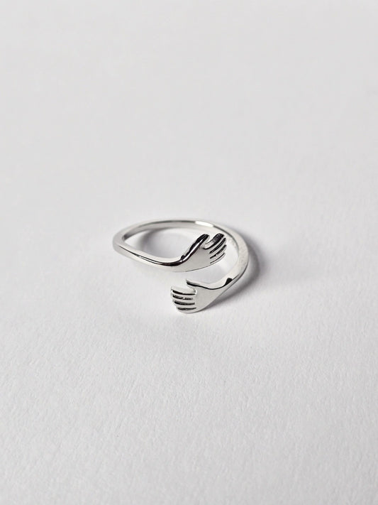 Sterling Silver ring with a unique design on a light grey background
