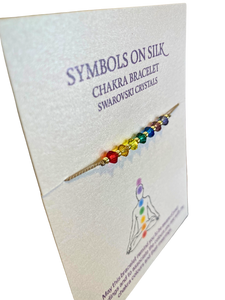 Seven chakras bracelet on silk band with Swarovski crystals for balance.