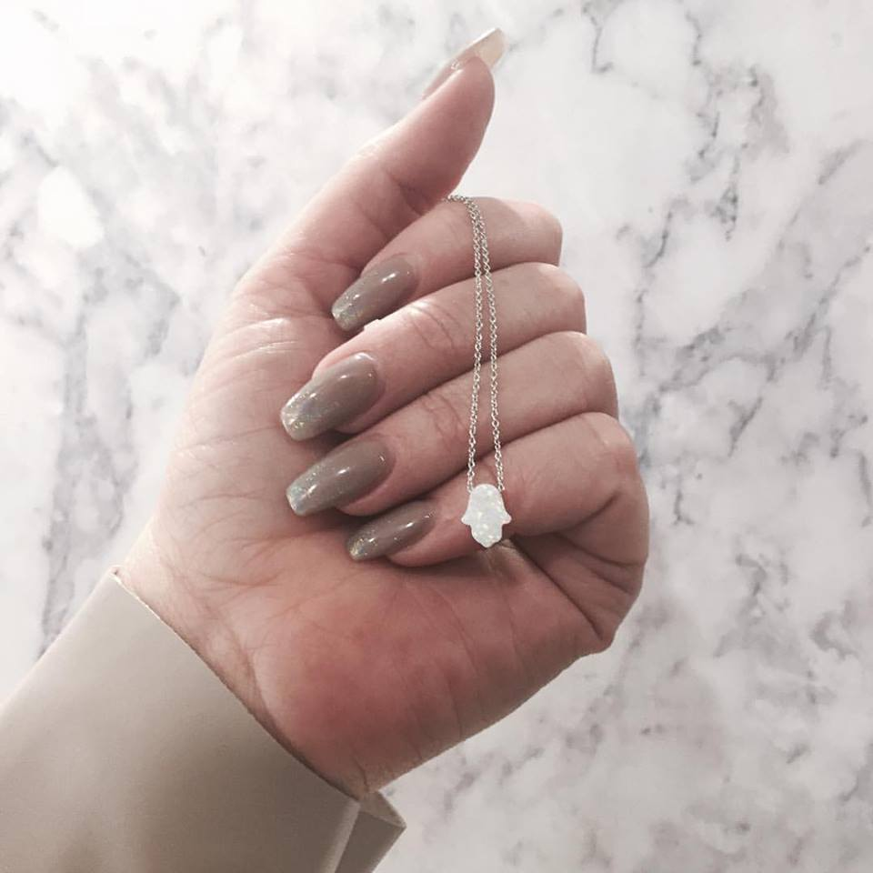 Opal hamsa hand necklace.