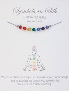 Silk necklace adjourned with Chakra style Swarovski Crystals 