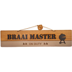 Hanging wood sign that says: "Braai master on duty".