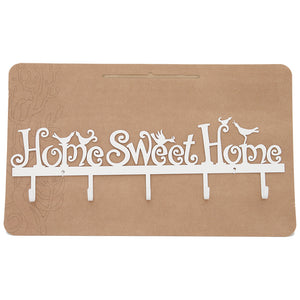 White powder coated steel "home sweet home" hanging with five hooks and embellished with birds on a cardboard backing.