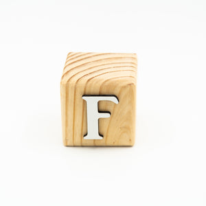 Wooden alphabet letter block F.