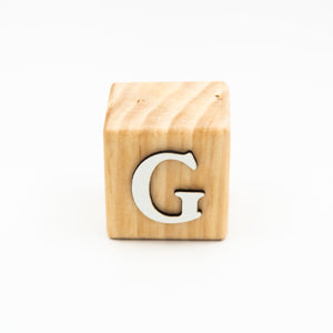 Wooden alphabet letter block G.