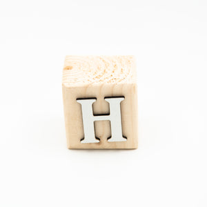 Wooden alphabet letter block H.