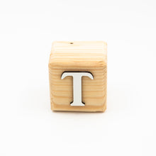 Wooden alphabet letter block T.