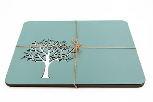 Four duck egg coloured wooden placemats with a laser cut tree of life motif.