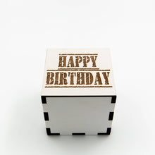 White, square wooden laser cut box with the words: "happy birthday" etched on the lid.