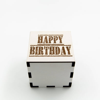 White, square wooden laser cut box with the words: 